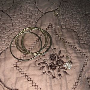 Bracelets and a lucky charm necklace.